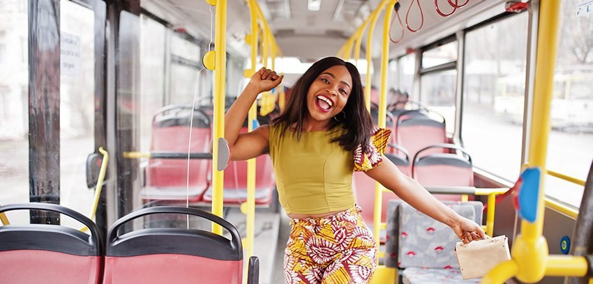 Girl standing inside a bus